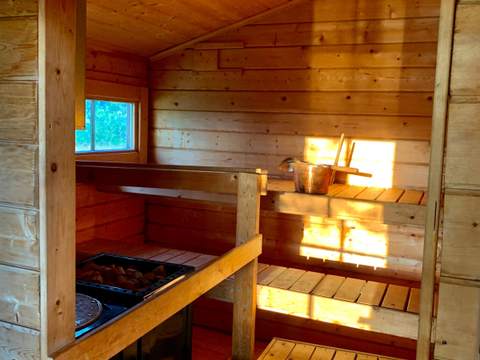 Casa da sauna: A cabine da sauna e o seu fogão a lenha, ver em ecrã inteiro